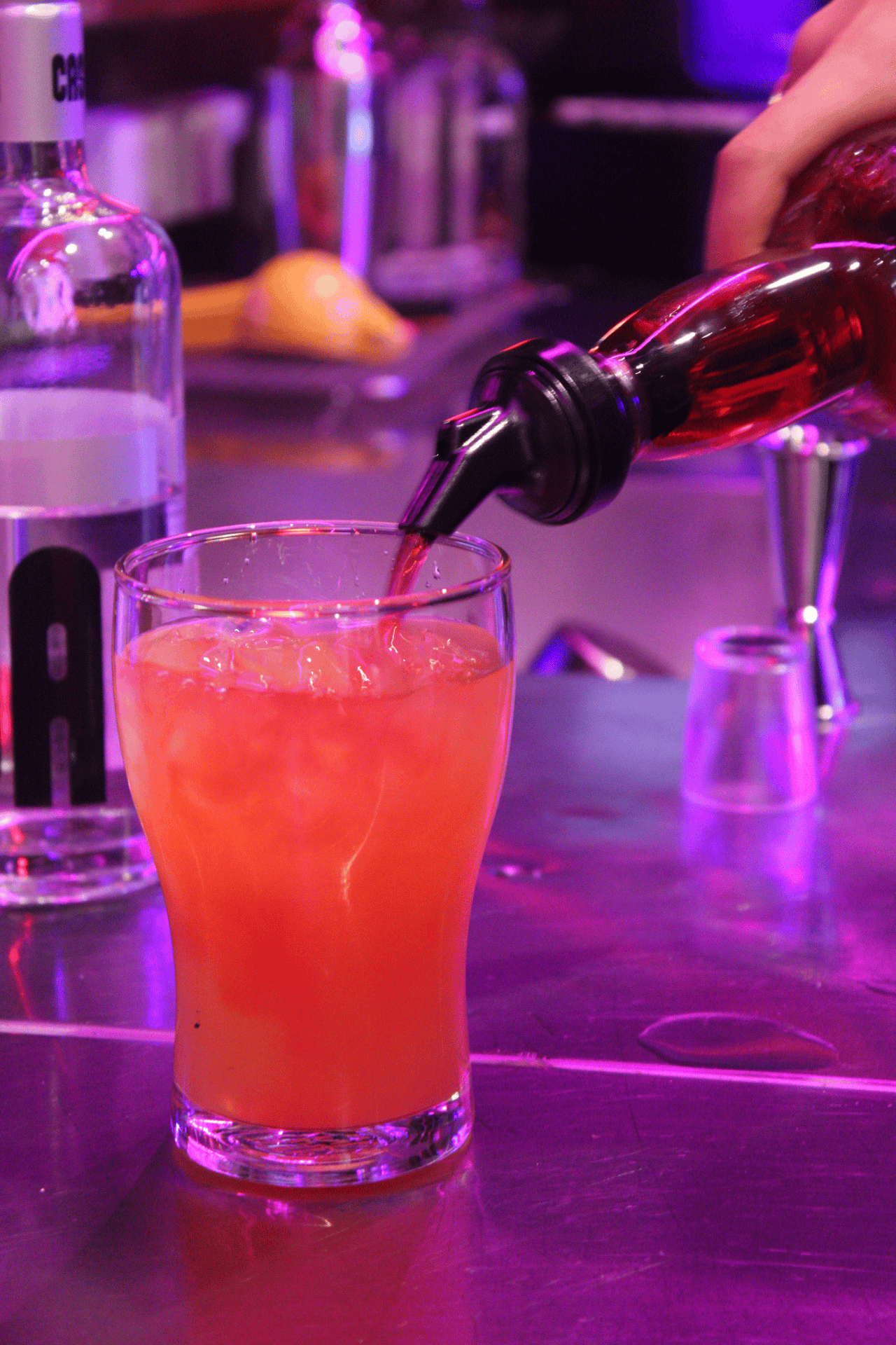 Pouring signature drinks and premium bottle service details